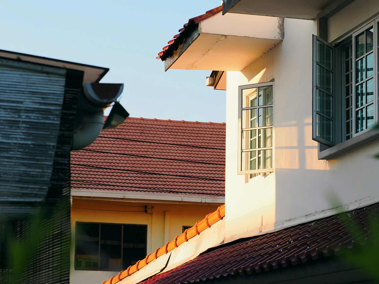 Suburban Rocklin home viewed from ground level showing roofline and gutters for DIY no-ladder inspection